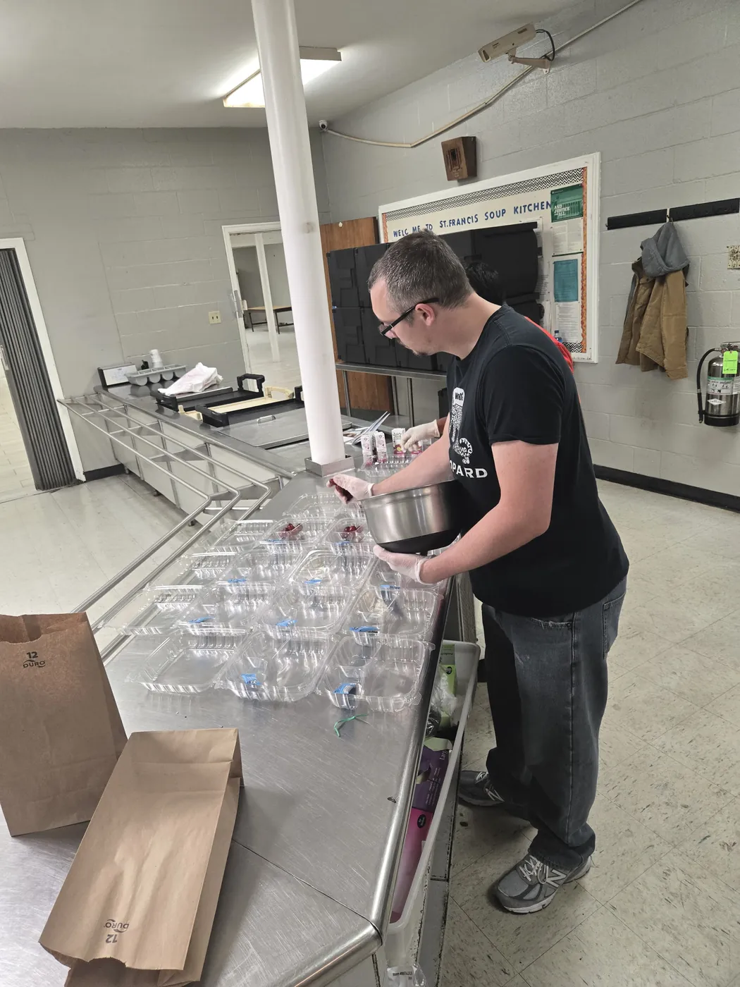 A volunteer in the St. Francis soup kitchen on Market Street, Allison Hill