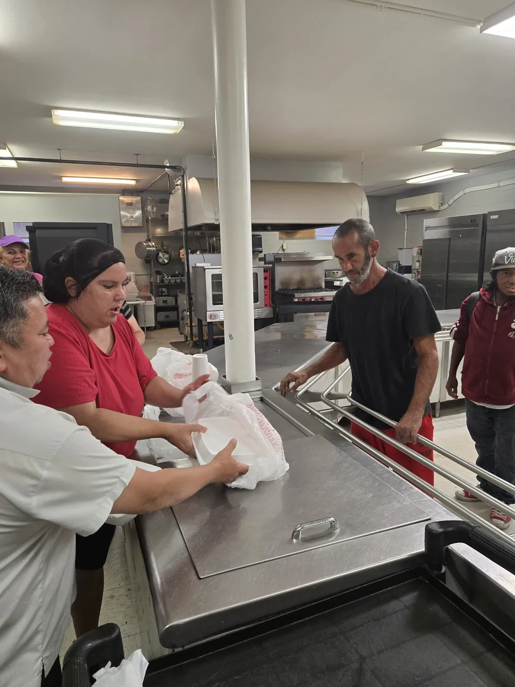 A volunteer in the St. Francis soup kitchen on Market Street, Allison Hill